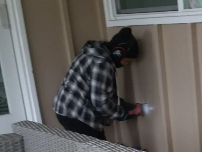 Professional electrician installing an exterior outlet in Bridgeville